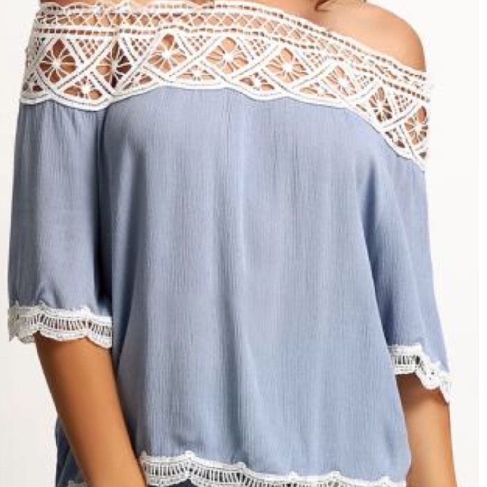 Light blue off-the-shoulder blouse with lace trim